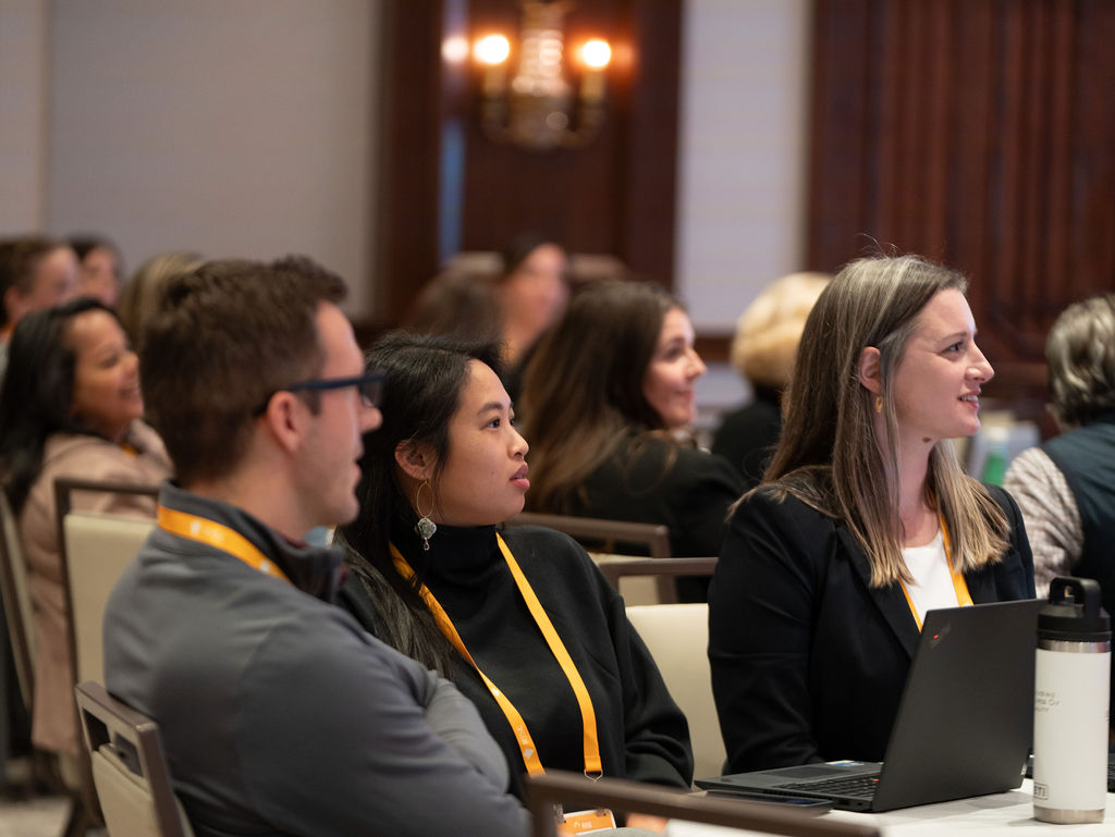 Attendees listening to a session